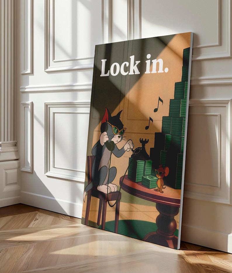 May include: A framed canvas print featuring Tom and Jerry cartoon characters. Tom, wearing sunglasses and headphones, is on the phone. Jerry is standing on a table with stacks of money. The text "Lock in" is at the top.