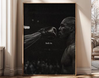 May include: A black and white framed wall art print featuring a side profile of a boxer facing a gloved fist. The image is dark and moody with the text lock in. centered between the figures. The composition captures a intense moment.