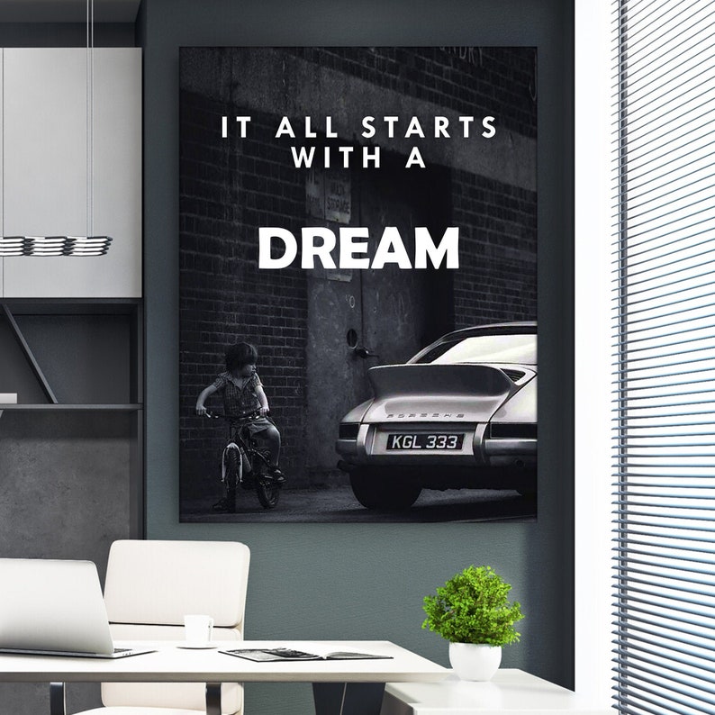 May include: Black and white photo of a child on a bicycle in front of a silver Porsche with the text "IT ALL STARTS WITH A DREAM" above the car.