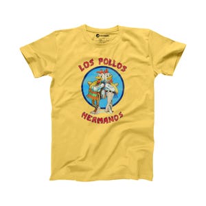 May include: Yellow t-shirt featuring a graphic of two cartoon chickens wearing sombreros and the text "Los Pollos Hermanos".