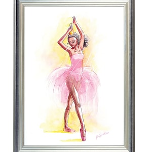 May include: Watercolor painting of a ballerina in a pink tutu and pointe shoes, framed in a silver frame. The ballerina is posed with arms raised, wearing a crown. The background is a soft yellow.