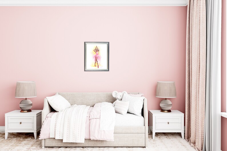 May include: A framed watercolor painting of a ballerina in a pink tutu, arms raised, set against a yellow and pink background. The artwork hangs on a pink wall above a bed with white and pink bedding.