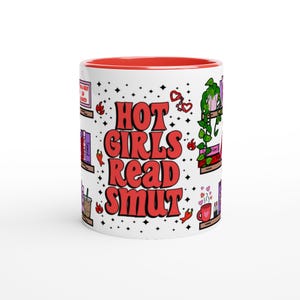 May include: White ceramic mug with a red interior and the text "HOT GIRLS READ SMUT" in red. The mug features illustrations of books, plants, hearts, and chili peppers. The mug is decorated with black dots.