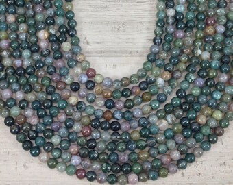May include: A strand of round, green, brown, and purple agate beads. The beads are approximately 8mm in diameter and have a natural, polished finish.