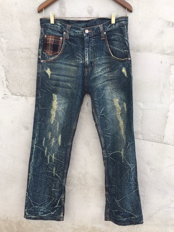 Asna Dispect Ripped Patch Jeans