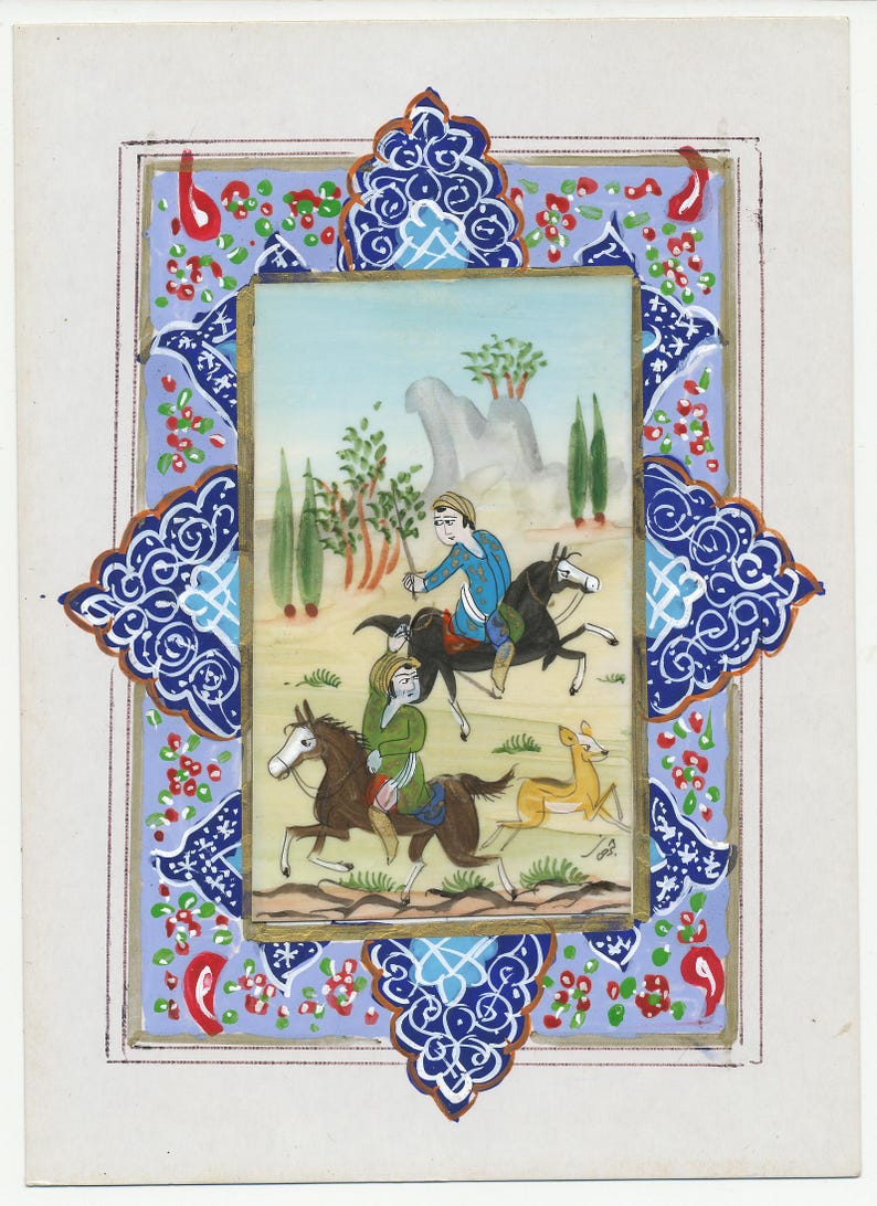 May include: An antique miniature painting depicting a hunting scene with two riders on horseback and a deer. The artwork is framed with ornate blue and red floral patterns and a gold border. The background features a light blue sky and rolling hills.