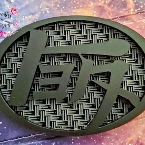 matte black TEQ with carbon fiber engraved background.