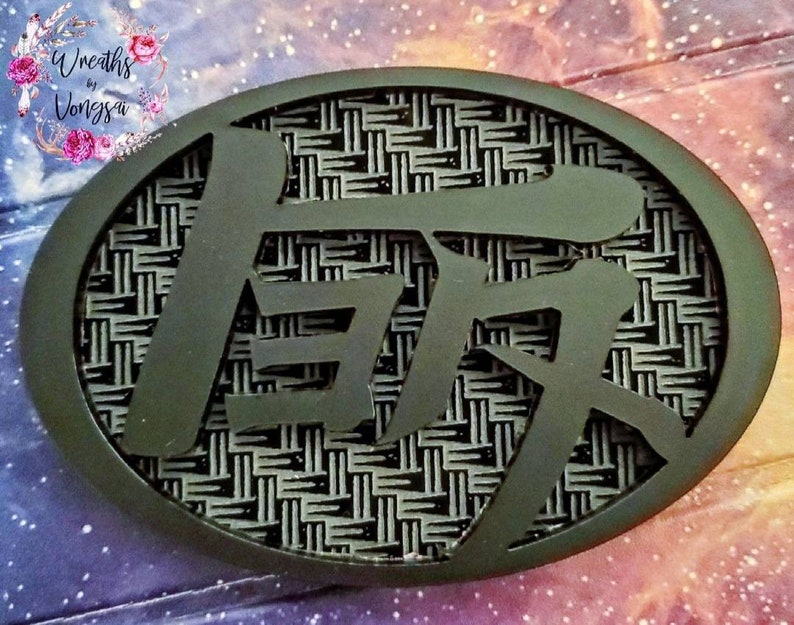 matte black TEQ with carbon fiber engraved background.