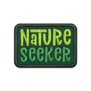 May include: Green embroidered patch with the text "Nature Seeker" in a light green color.
