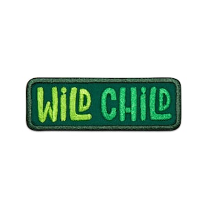 May include: Green embroidered patch with the text "WILD CHILD" in a light green color.
