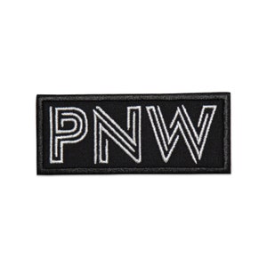 May include: Black rectangular patch with white embroidered letters that spell out "PNW".