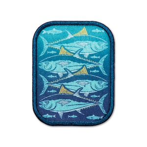 May include: A blue and yellow embroidered patch with a repeating pattern of tuna fish swimming in a blue ocean. The patch has a dark blue border.
