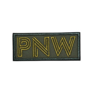 May include: A green fabric patch with a black border and the text "PNW" in gold embroidery.