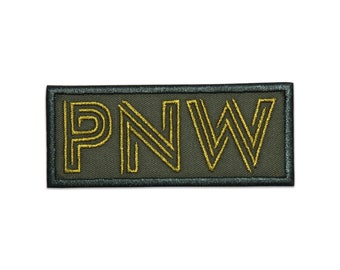 May include: A green fabric patch with a black border and the text "PNW" in gold embroidery.
