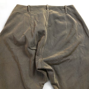 May include: A pair of brown corduroy pants with a center seam down the back.