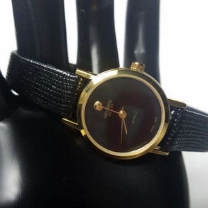Vintage Helbros Ladies Gold Tone Quartz Watch Black Face Black Band New In Original Box