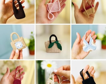 May include: A collection of miniature crochet handbags in various colors and styles. The bags include a dark brown tote, a pink rectangular bag with a strap, and a beige bag with a blue and white square design. Other bags are beige, black, and red.