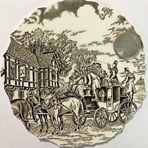 May include: A black and white vintage style plate featuring a scene of a horse-drawn carriage and a building with a sign that reads "The Cross Keys".