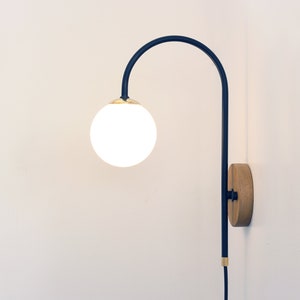 Plug in wall lamp , Bedside sconce, Brass wood and glass globe wall mounted lamp, Wall light fixture, Designer lamp.