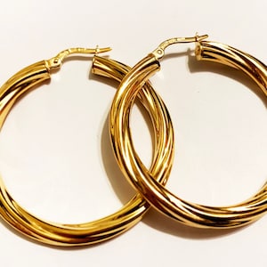 10k massief geelgouden swirly-oorbellen: grote dikke statement-sieraden
