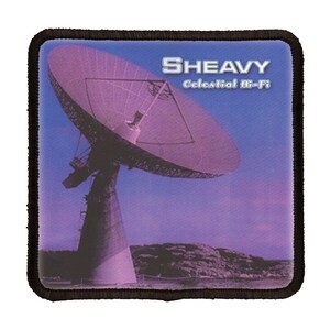 May include: A black and white patch with a large satellite dish against a purple and blue sky. The text "SHEAVY Celestial Hi-Fi" is printed on the patch.