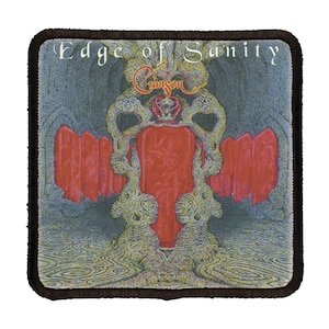 May include: A square fabric patch with a black border. The patch features a dark blue background with a red and gold design. The text "Edge of Sanity" is printed in white at the top of the patch.