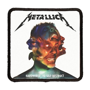 May include: A white square patch with black stitching around the edges. The patch features a colorful image of a man's face with multiple distorted faces superimposed on top of each other. The text "METALLICA" is printed in black at the top of the patch. The text "HARDWIRED...TO SELF-DESTRUCT" is printed in black at the bottom of the patch.