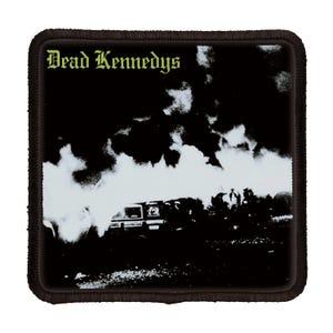 May include: Black and white patch with the text "Dead Kennedys" in a green font. The patch features a car engulfed in smoke.