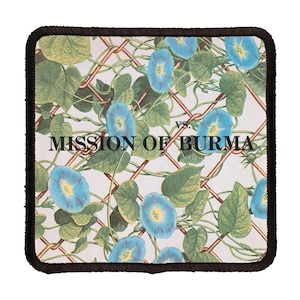 May include: A square patch with a white background and a black border. The patch features a repeating pattern of blue morning glory flowers and green leaves climbing a wire fence. The text "MISSION OF BURMA" is printed in black letters across the center of the patch.