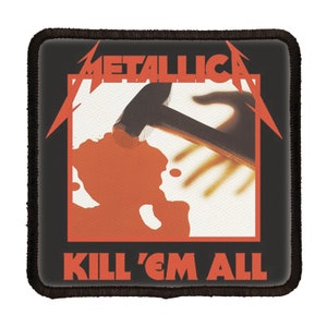 May include: Black and white patch with the band name "Metallica" and the album title "Kill 'Em All" in red. The album cover art features a bloody hand with a hammer striking it.