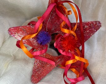 Set of 3 handmade star ornaments : red and fuchsia-stained wood, iridescent glitter, coordinating ribbons & poms - great as gift tags too!