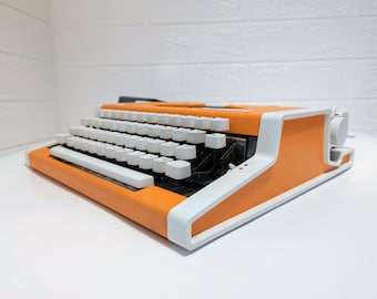 Machine à écrire mécanique vintage / Machine à écrire orange qui ne fonctionne pas / Machine à écrire avec étui / Machine à écrire Mid Century / Unis TBM de Luxe / Années 70
