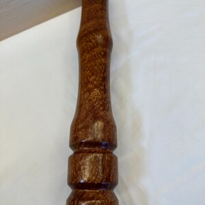 Bate de sapele con pomo