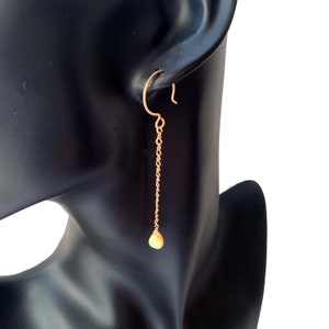 May include: A trio of ceramic mugs with a speckled, matte finish in cream, light grey, and dark grey. Each mug features a simple, minimalist design, ideal for tea or coffee.