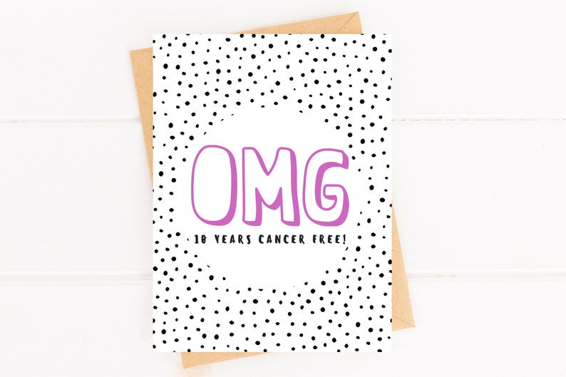 May include: A white card with black polka dots and the words "OMG 10 YEARS CANCER FREE!" in pink.