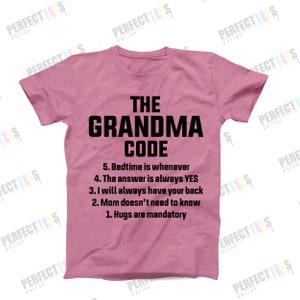 May include: Pink t-shirt with black text that reads "The Grandma Code" and a list of rules: "5. Bedtime is whenever", "4. The answer is always YES", "3. I will always have your back", "2. Mum doesn't need to know", "1. Hugs are mandatory."