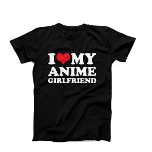 May include: Black t-shirt with the text "I ❤️ MY ANIME GIRLFRIEND" in white, with a red heart replacing the word "love". The shirt is a crew neck style.