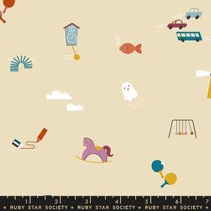 May include: Beige fabric featuring a playful pattern of illustrations. The design includes a clock, a rocking horse, a fish, a ghost, clouds, cars, a playground, and a paint roller. The text "RUBY STAR SOCIETY" is at the bottom.