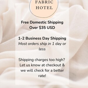 The image is a promotional image for a fabric hotel, advertising free domestic shipping over $35 USD. It features a close-up of a fabric material, possibly a white fabric, with text providing details about the hotel's shipping services.