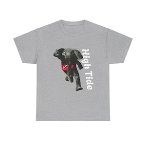 May include: A gray t-shirt with a cartoon elephant wearing a red and white jersey and the text "High Tide" in white.