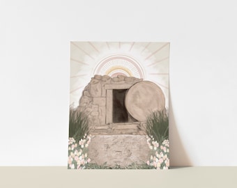 May include: An artistic print depicting an open tomb with a large stone rolled away. The scene is illuminated by a radiant sunburst in soft pastel colors. Green grass and white flowers frame the tomb, creating a serene and hopeful composition.