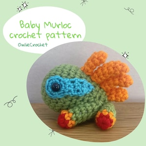 May include: A crocheted green and orange baby Murloc with a blue eye patch. The crochet pattern is available for purchase from OwlieCrochet.