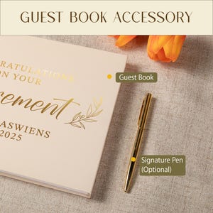 May include: A cream-colored guest book with gold foil text that reads Congratulations on your retirement, followed by the name Jaswiens and the year 2025. A gold-toned signature pen is placed next to the book, which features a leaf illustration.