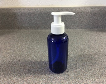 May include: A blue plastic bottle with a white pump dispenser. The bottle is on a gray countertop.