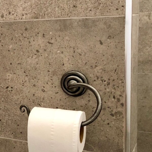 Scroll toilet paper holder.