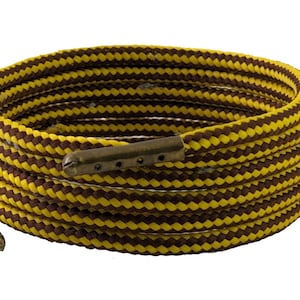 May include: A coiled brown and yellow striped rope with metal ends. The rope is coiled in a circle and has a metal clasp on one end.