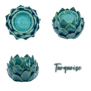 May include: Turquoise ceramic artichoke shaped candle holder. The holder has a wide, shallow bowl for a tealight candle.
