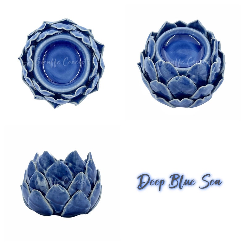 May include: A blue ceramic artichoke-shaped wax melt burner. The burner has a deep blue glaze and a small well in the center for the wax melt. The text "Deep Blue Sea" is written in white letters on a blue background.