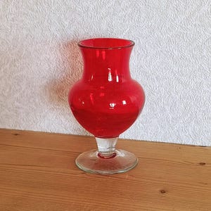 Soviet vintage glass ruby red vase on leg for flowers