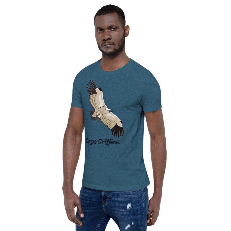 May include: A teal blue t-shirt featuring a graphic of a Cape Griffon vulture in flight. The text "Cape Griffon" is printed below the bird.